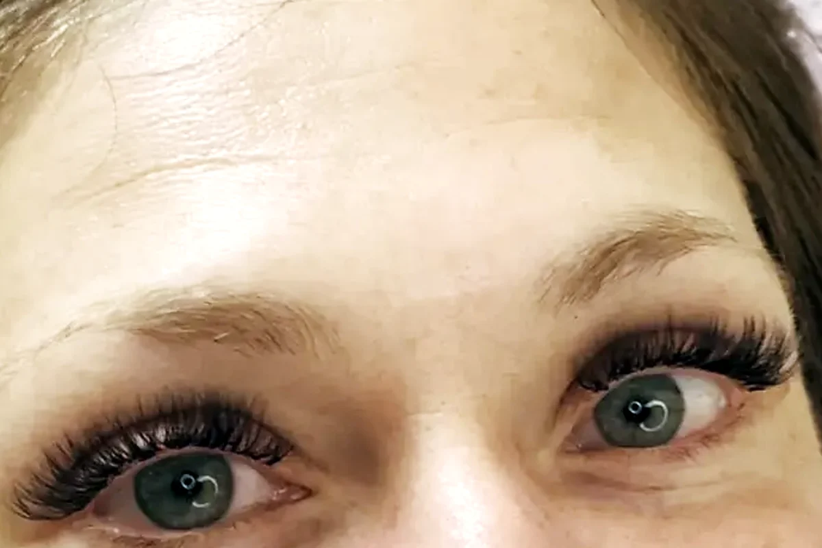 Lash extensions on a client with her eyes open, looking straight ahead